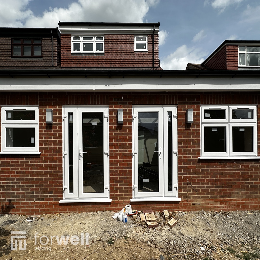 Completed extension with new white uPVC windows and doors Completed extension with new white uPVC windows and doors