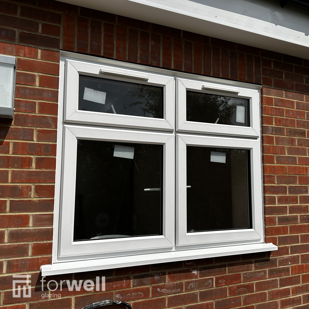 White uPVC windows fitted to a brick extension White uPVC windows fitted to a brick extension